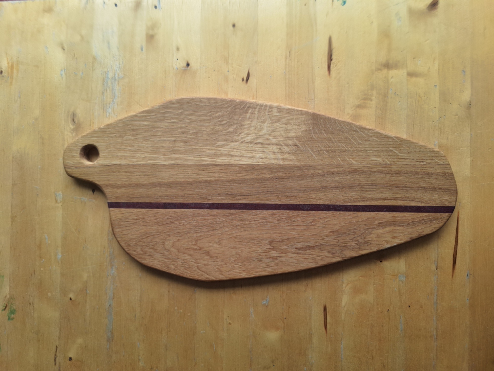 Hand-carved oak serving board with contrasting inlay