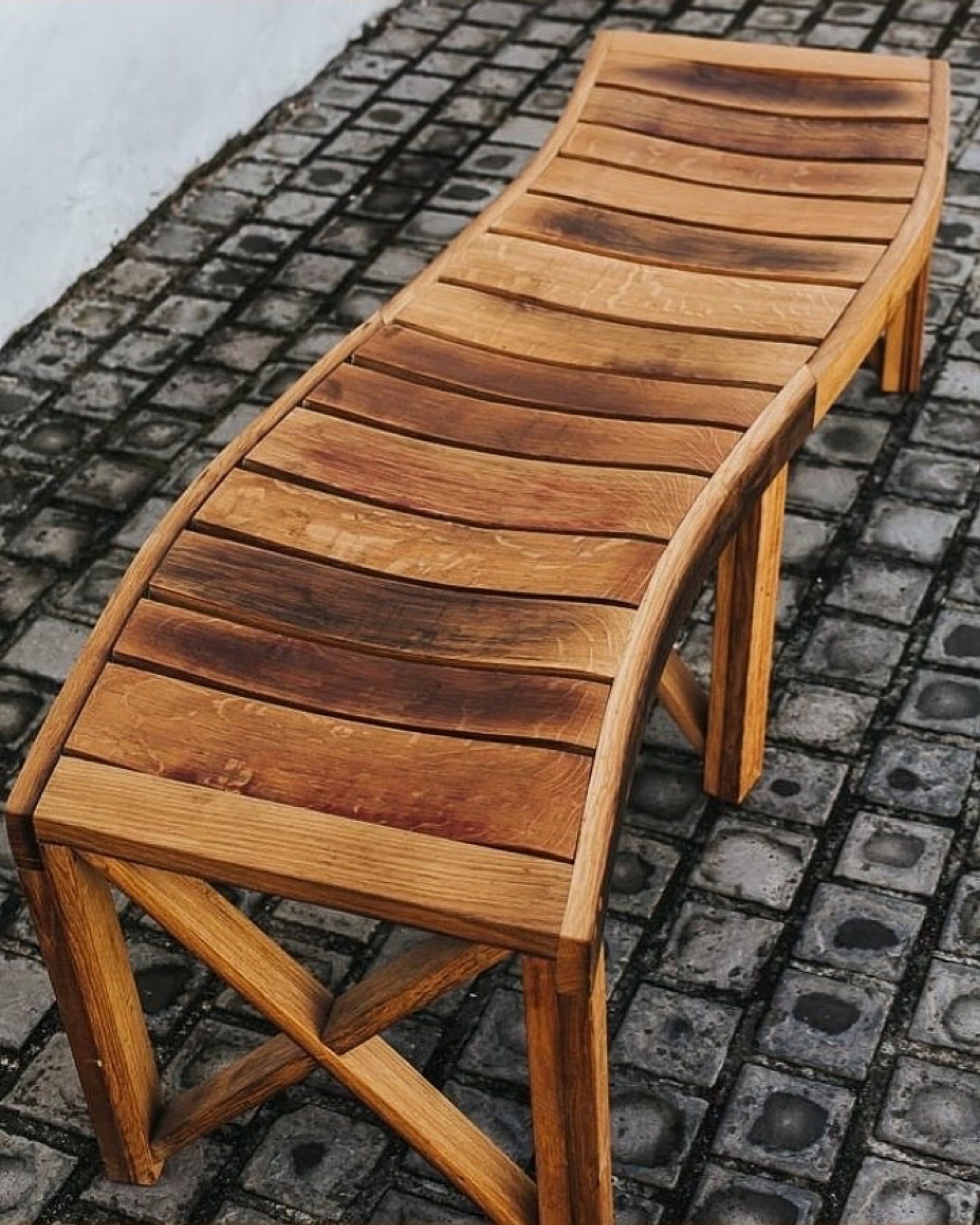 Curved artisan-crafted oak stave bench